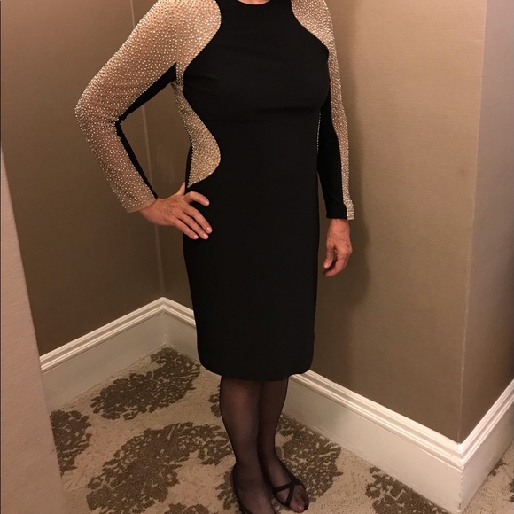 Xscape Dresses & Skirts - Black dress with beaded sleeves and side inserts.